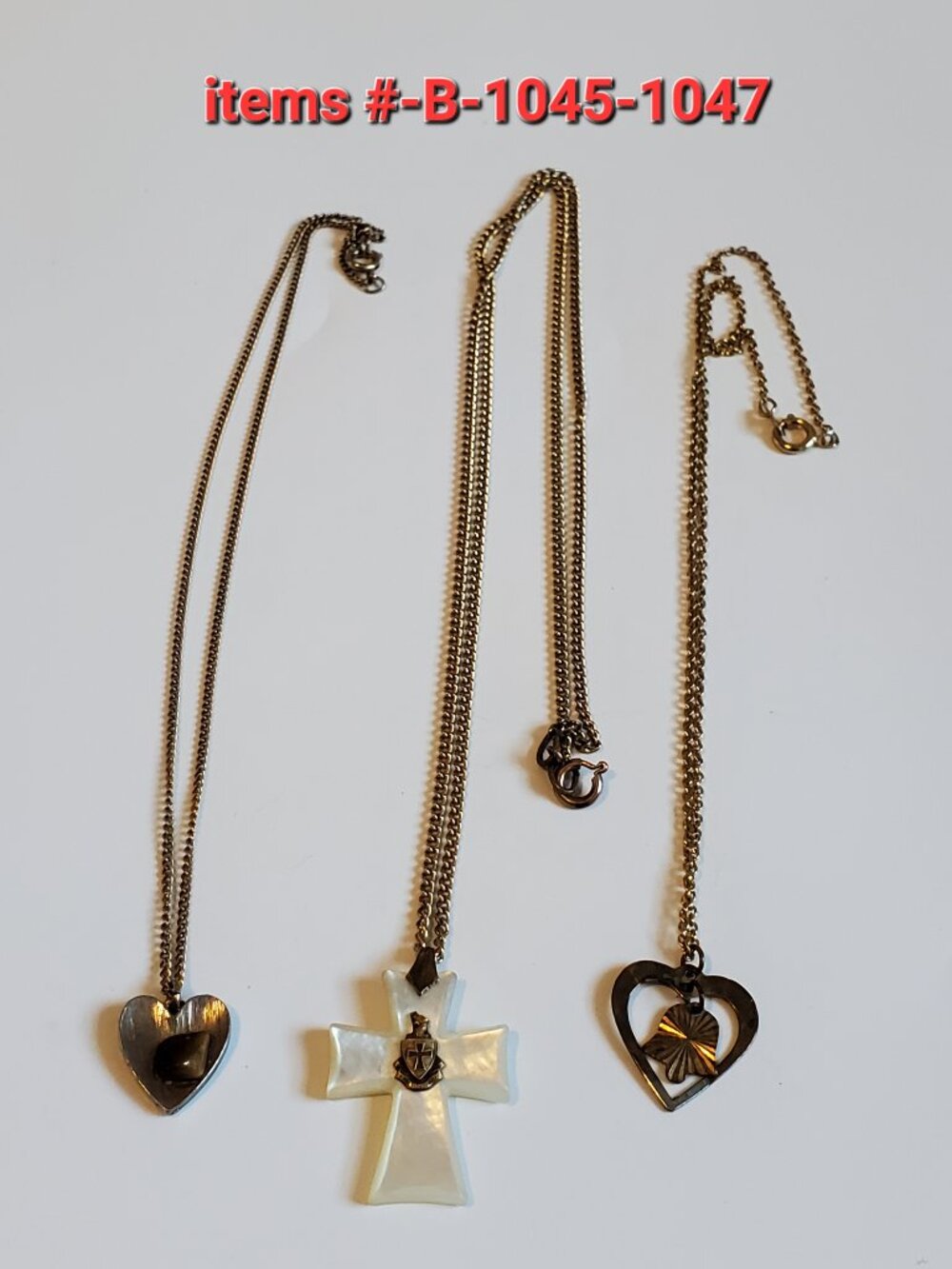 3 gold chain necklaces with small pendants,. items# B-1045-1047,. wt . 17 grams.
